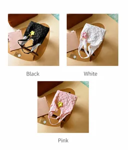 Detailed view of floral canvas tote bags in black white and pink with 3D texture