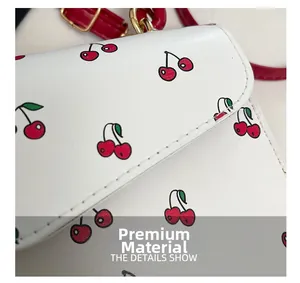 Detailed macro view of white PU leather texture with red cherry print and neat stitching