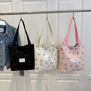 Minimalist corduroy tote bags with cherry patterns in black, white, and pink colors