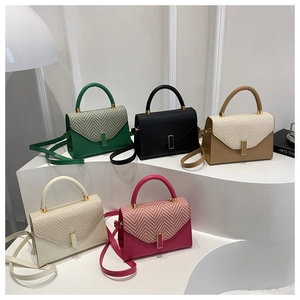Detailed display of five colorful minimalist crossbody bags with textured woven flaps