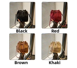 Detail view of mini bucket bag in black red brown and khaki colors with drawstring