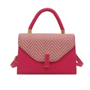 Magenta leather square bag with V-shaped woven flap and gold hardware on white background