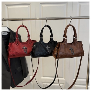 Three gothic style Boston bags in red black and brown with metal cross and chain detail