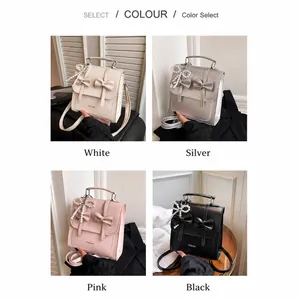 Four-color display of mini handbags in white, silver, pink, and black with bow details
