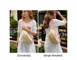 Detail showing cream nylon chest bag with pink Lucky logo and adjustable strap