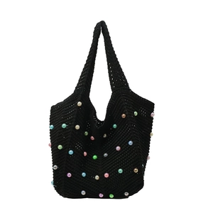 Handmade black crochet tote bag with colorful bead accents and V-shape knit pattern