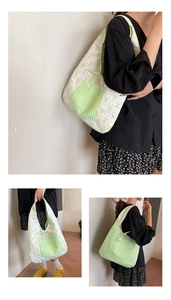 Detail of floral canvas tote bag featuring double-sided print with gingham bow and ribbon tie