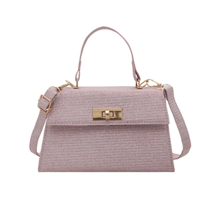 Pink textured crossbody handbag with golden rotary clasp and top handle for women