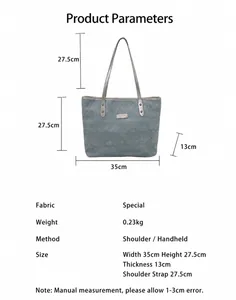 Detailed size chart of blue denim tote bag showing dimensions and strap height