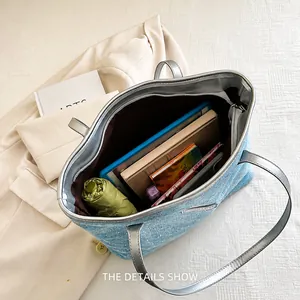 Detail showing high capacity of denim glitter tote with tablet and accessories