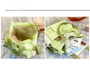 Detailed interior view of a light green canvas tote bag with multiple storage pockets