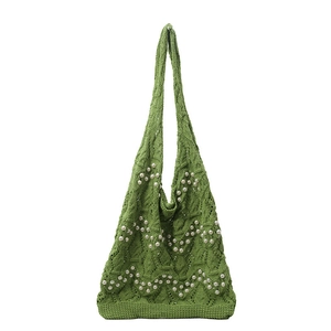 Green crochet tote bag with pearl bead embellishments and long woven shoulder straps
