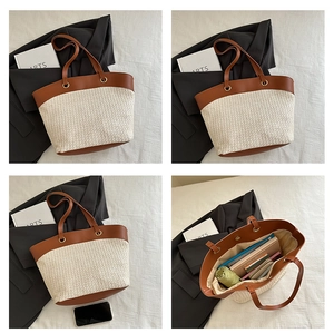 Macro view of woven straw tote bag with brown leather handles and large storage capacity
