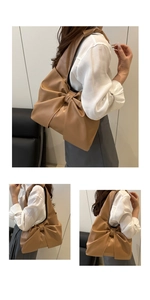 Detailansicht der khakifarbenen Schultertasche mit großer Schleife und hochwertigem Kunstleder