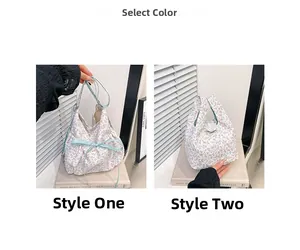 Detail view of large floral print canvas tote bags with green bow and handle options