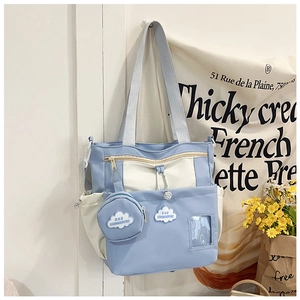 Detail of canvas tote bag with cloud embroidery, coin purse and transparent card slot