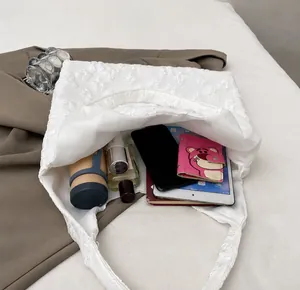 Interior view of floral lace tote bag showing large capacity for daily essentials