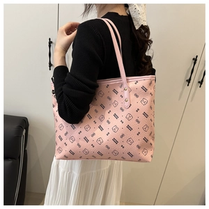Close-up of pink tote bag featuring lychee texture PU leather and cute bear patterns