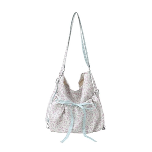 Large floral bucket bag with drawstring closure and blue checkered ribbon accent