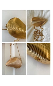 Detailed four-way view of shell-shaped gold evening bag with metallic texture and chain