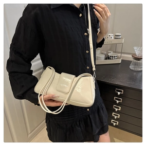 Chic cream rectangle baguette bag with magnetic flap shown in a daily lifestyle setting