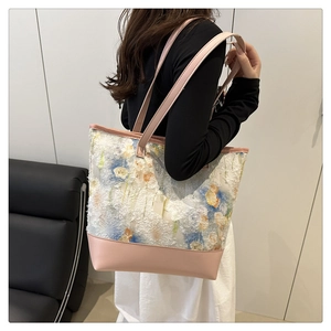 Detail of pink leather base and 3D floral texture on the large tote shoulder bag