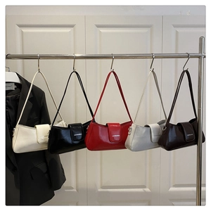 Selection of glossy faux leather baguette bags in beige, black, red, grey, and brown