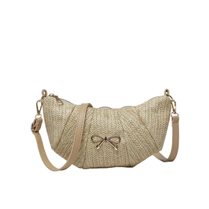 Chic beige woven crescent bag with golden bow clasp and slender shoulder strap