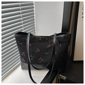 Black cherry print tote bag with vertical texture and vegan leather straps