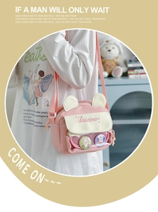 Detailed close-up of a pink bear-ear ita bag with a transparent front mesh pocket
