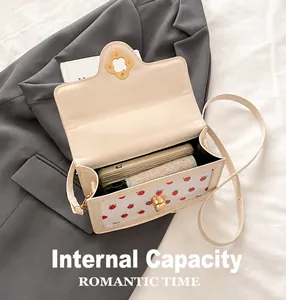 Internal capacity of the beige square crossbody bag with phone and wallet inside