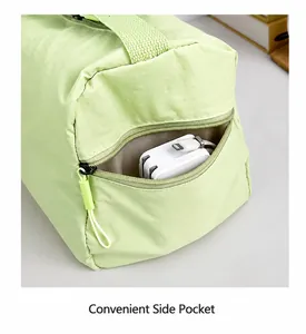 Close-up of mint green travel bag side pocket storing electronic accessories