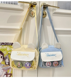 Detailed view of animal-eared shoulder bags with transparent badge pockets in two colors