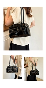 Detail view of black glossy PU shoulder bag with bow accents and dual strap design