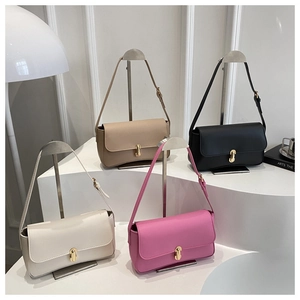 Detail showing quartet of minimalist shoulder bags with signature golden J-shaped lock