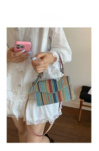 Model display of colorful woven crossbody bag with striped pattern and bohemian style