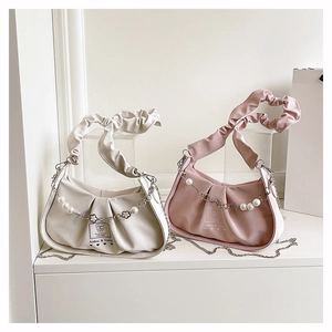 Detail of ruched cloud handbag with pearl floral chain and cartoon bear print