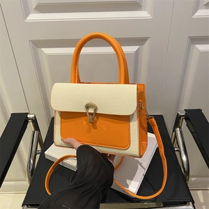 Modern orange leather and woven crossbody handbag with golden buckle for summer daily wear