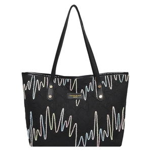 Large black quilted tote bag with colorful embroidery and long shoulder straps