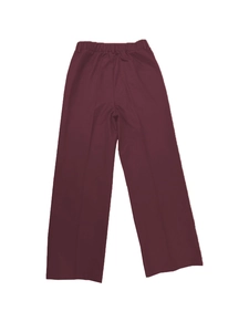 Detail of burgundy high-waisted wide-leg trousers featuring elastic waistband and smooth fabric