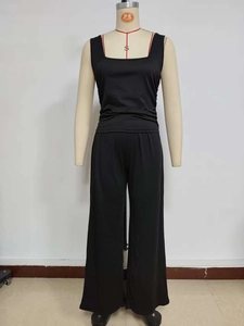 Detail of black two-piece casual set featuring round neck tank top and wide-leg trousers