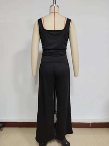 Detail view of the back of a black two-piece set featuring a racerback top and wide-leg pants