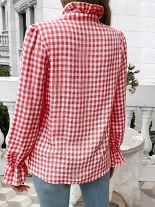 Back view of red gingham plaid shirt with high ruffle neck and long flounced sleeves