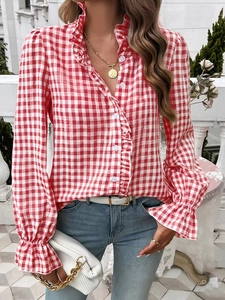 Detail of red and white gingham blouse featuring ruffled stand-up collar and elastic cuffs