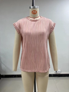 Detail view of the vertical pleated texture on this light pink sleeveless summer top