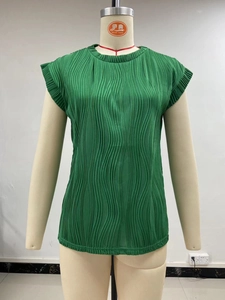 Detail of green pleated fabric texture on sleeveless round neck summer top for women