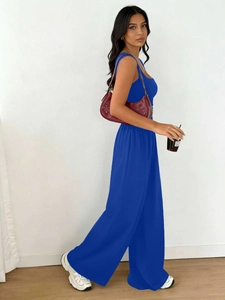 Detail of royal blue sleeveless top and wide-leg trousers set with fabric texture