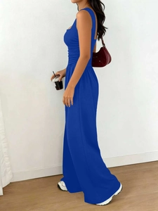 Detail of royal blue sleeveless top and high-waist wide-leg pants two-piece set