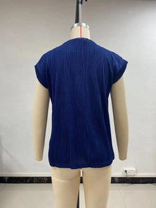Detailed back view of dark blue pleated short-sleeve top with vertical accordion texture