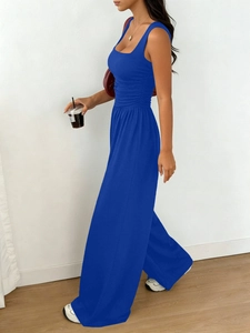 Detail of royal blue sleeveless top and wide-leg pants set with pleated waist design